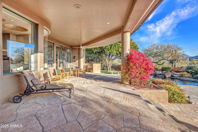 view of patio / terrace with ceiling fan