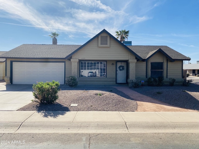 single story home featuring a garage