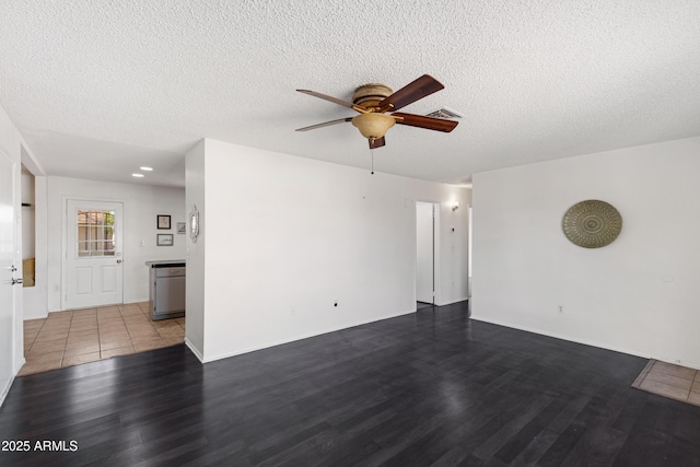 unfurnished room featuring hardwood / wood-style floors, a textured ceiling, and ceiling fan