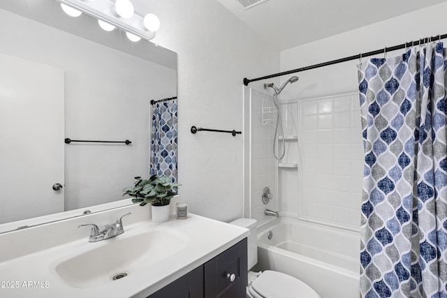 full bathroom featuring shower / tub combo with curtain, vanity, and toilet