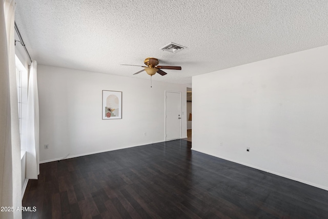 spare room with ceiling fan, dark hardwood / wood-style flooring, and a textured ceiling