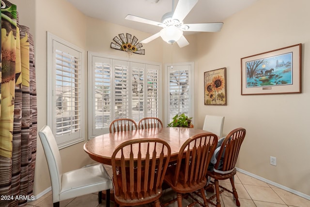 dining space featuring ceiling fan and light tile patterned floors