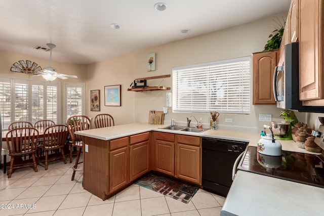 kitchen with dishwasher, a healthy amount of sunlight, kitchen peninsula, and sink