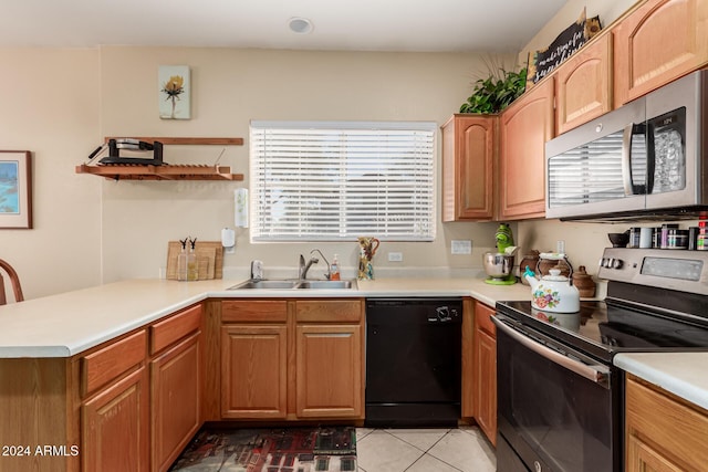 kitchen featuring light tile patterned floors, kitchen peninsula, sink, and appliances with stainless steel finishes