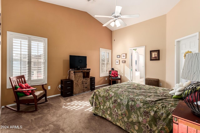 carpeted bedroom with connected bathroom, vaulted ceiling, and ceiling fan