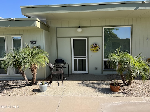 entrance to property with a patio