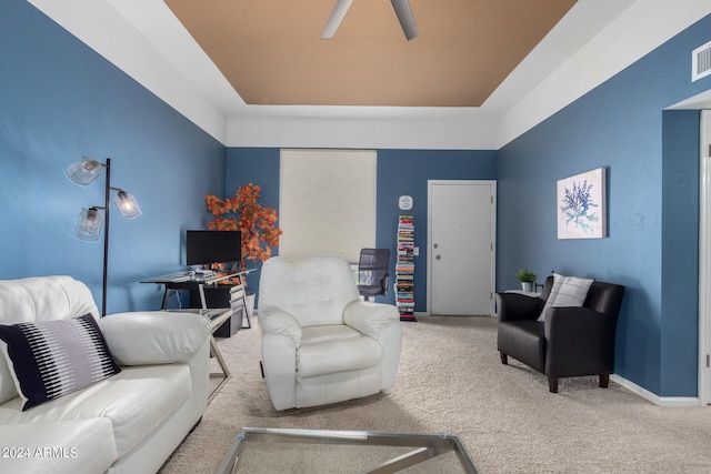 carpeted living room featuring ceiling fan