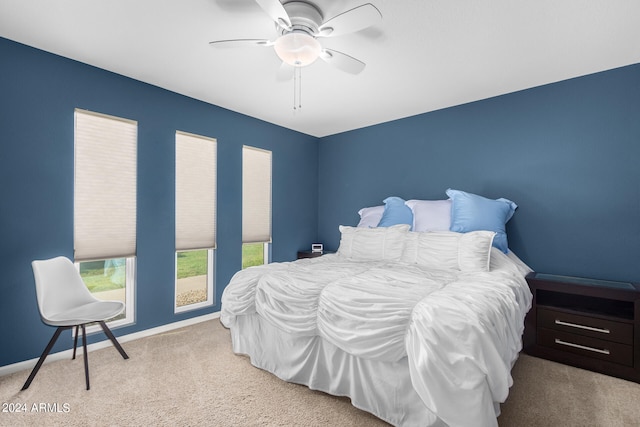 bedroom featuring ceiling fan and light colored carpet