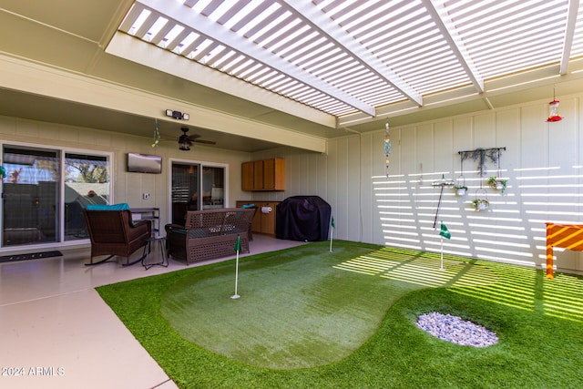 view of yard featuring a patio and ceiling fan