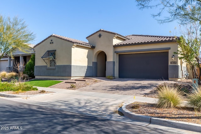 mediterranean / spanish-style house featuring a garage