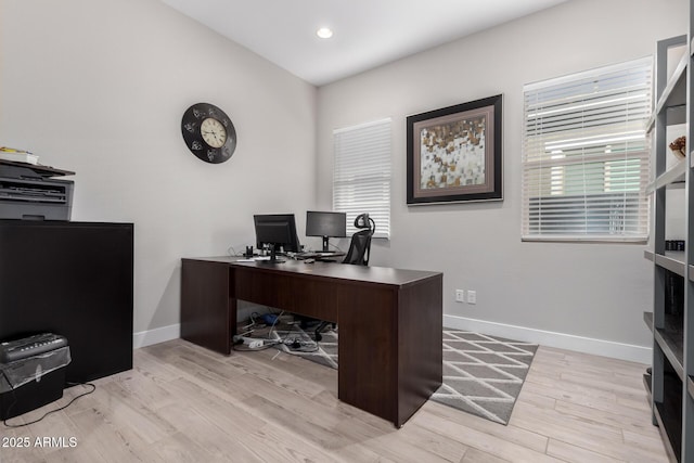 office area featuring a wealth of natural light and light hardwood / wood-style flooring