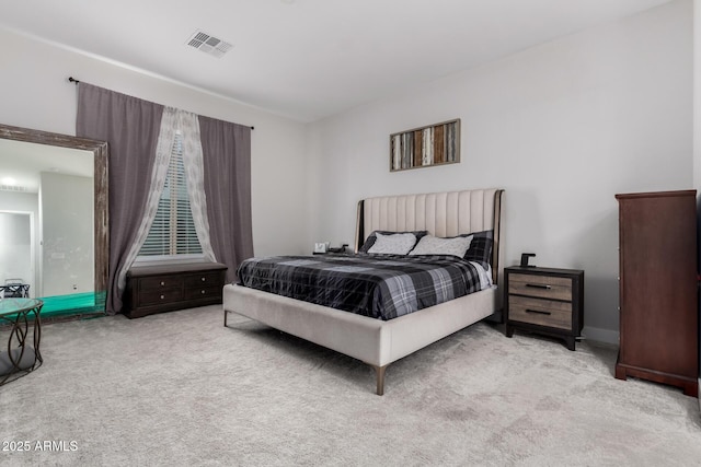 bedroom with light colored carpet