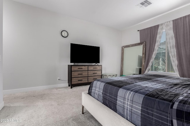 bedroom featuring light carpet