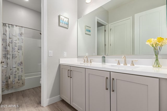 full bathroom with vanity, hardwood / wood-style flooring, shower / bath combination with curtain, and toilet