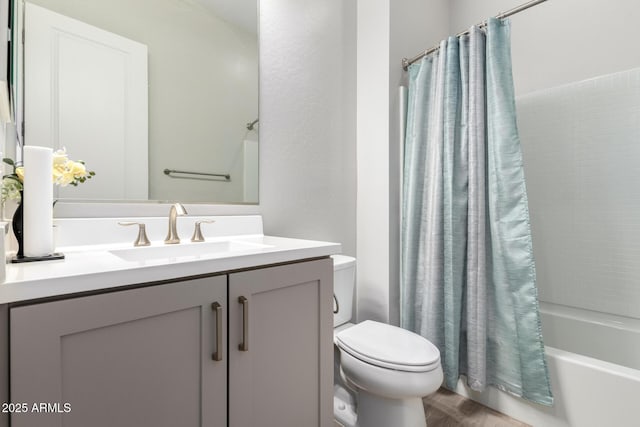 full bathroom with shower / bath combo, vanity, and toilet