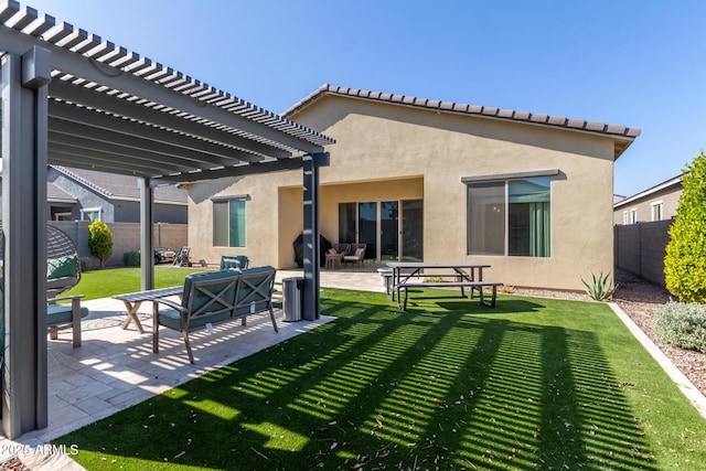 back of house with an outdoor hangout area, a pergola, a lawn, and a patio