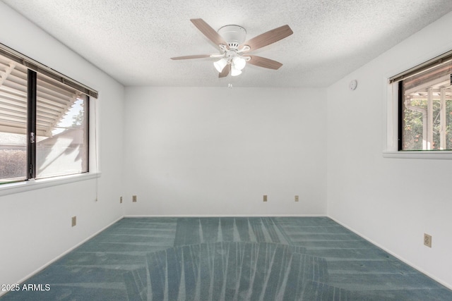 carpeted empty room with a textured ceiling and ceiling fan