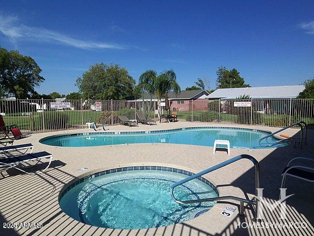 view of pool featuring a hot tub