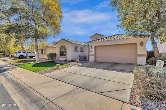 mediterranean / spanish-style home featuring a garage