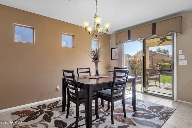 dining room with a notable chandelier and light tile patterned flooring