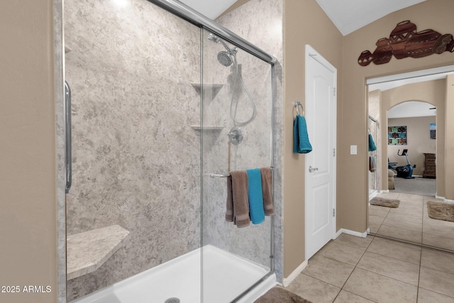 bathroom featuring tile patterned flooring and a shower with shower door