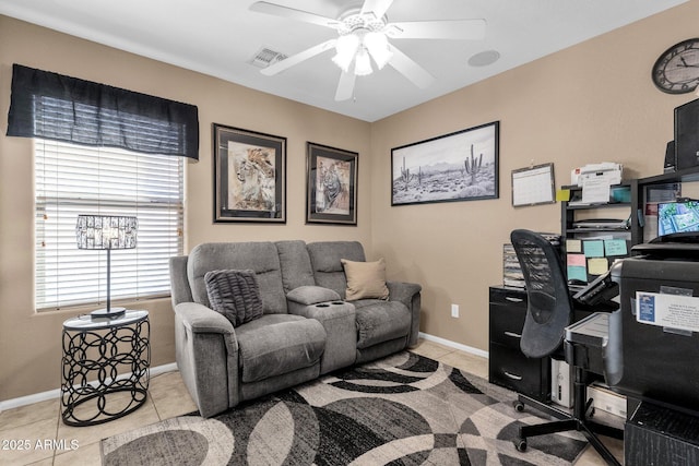 tiled office space featuring ceiling fan