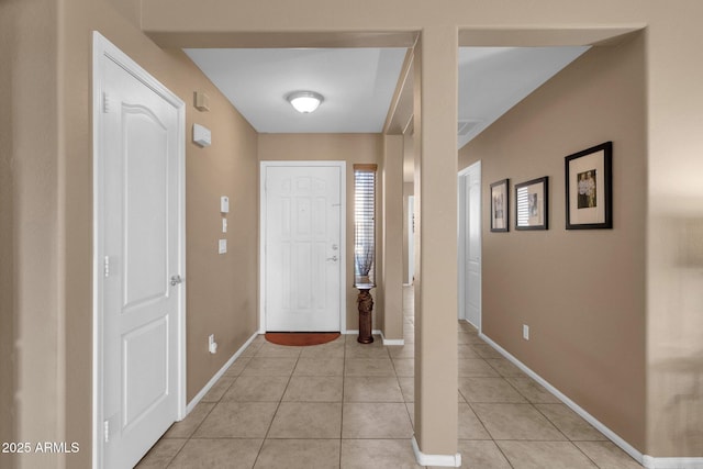 entryway with light tile patterned floors