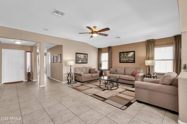 living room with light tile patterned floors, vaulted ceiling, and ceiling fan