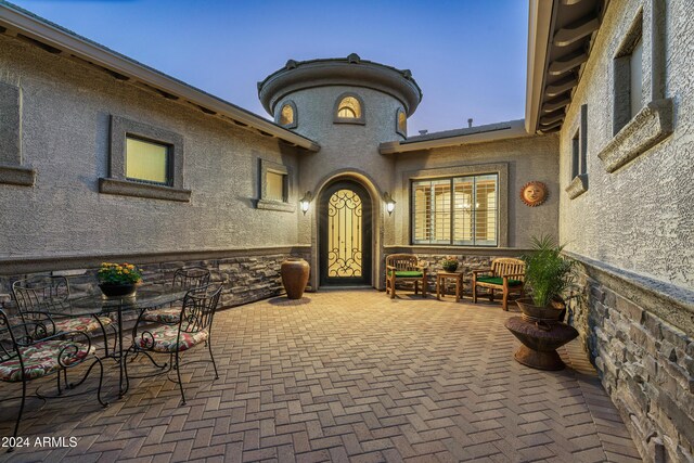 4126 S Last Chance Trl, Gold Canyon, AZ 85118 - doorway to property featuring a patio area and stucco siding