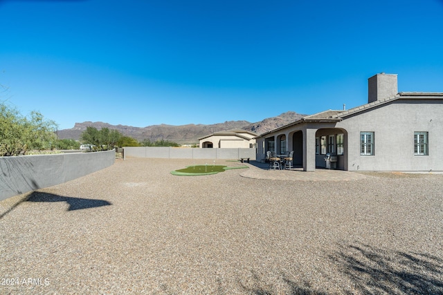 4126 S Last Chance Trl, Gold Canyon, AZ 85118 - view of yard featuring a mountain view, fence, and a patio