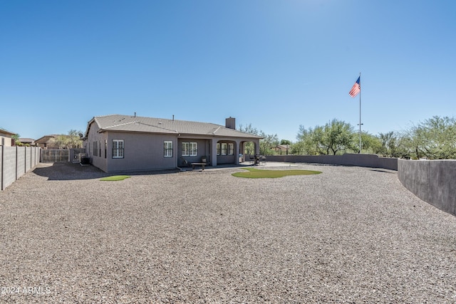 4126 S Last Chance Trl, Gold Canyon, AZ 85118 - rear view of house with a chimney, a patio, and a fenced backyard