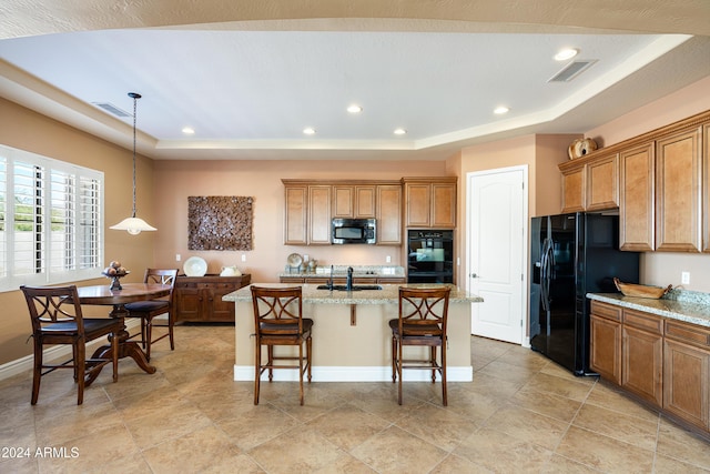 4126 S Last Chance Trl, Gold Canyon, AZ 85118 - kitchen featuring black appliances, a tray ceiling, brown cabinets, and recessed lighting