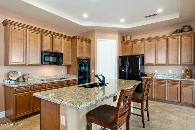 4126 S Last Chance Trl, Gold Canyon, AZ 85118 - kitchen featuring black appliances, a sink, brown cabinetry, a raised ceiling, and recessed lighting