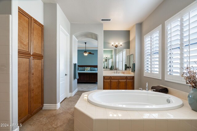 4126 S Last Chance Trl, Gold Canyon, AZ 85118 - ensuite bathroom with a bath, ceiling fan, tile patterned floors, vanity, and baseboards