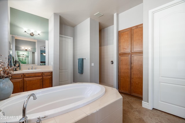 4126 S Last Chance Trl, Gold Canyon, AZ 85118 - full bath featuring a garden tub, vanity, and tile patterned floors