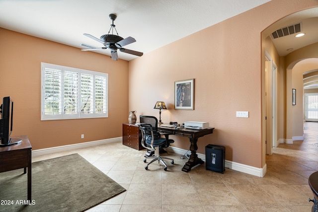 4126 S Last Chance Trl, Gold Canyon, AZ 85118 - tiled office space featuring arched walkways, ceiling fan, and baseboards