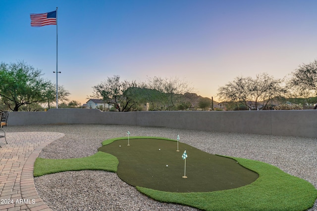 4126 S Last Chance Trl, Gold Canyon, AZ 85118 - view of home's community featuring an area to practice putting, a fenced backyard, and a patio