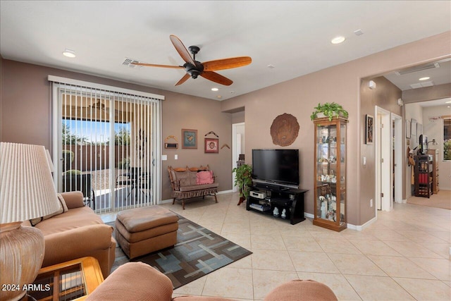 living room featuring light tile patterned floors and ceiling fan