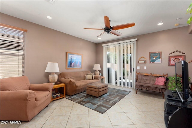 tiled living room with ceiling fan