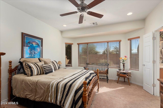 bedroom featuring light carpet and ceiling fan