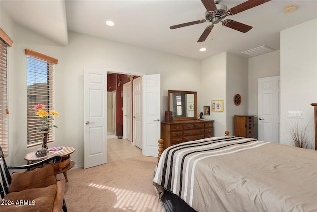 bedroom with light carpet and ceiling fan