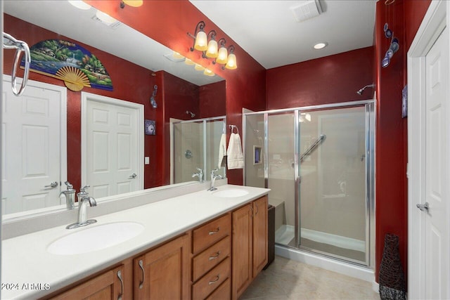 bathroom featuring walk in shower and vanity