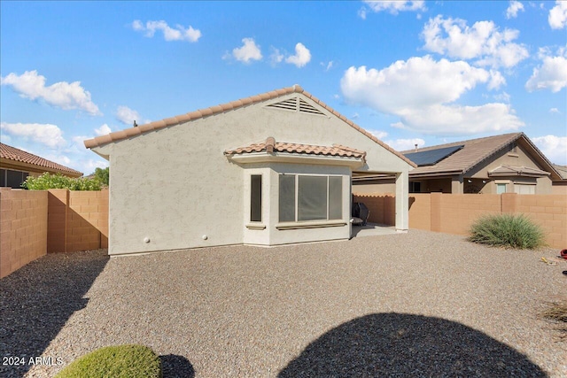 back of house featuring a patio area