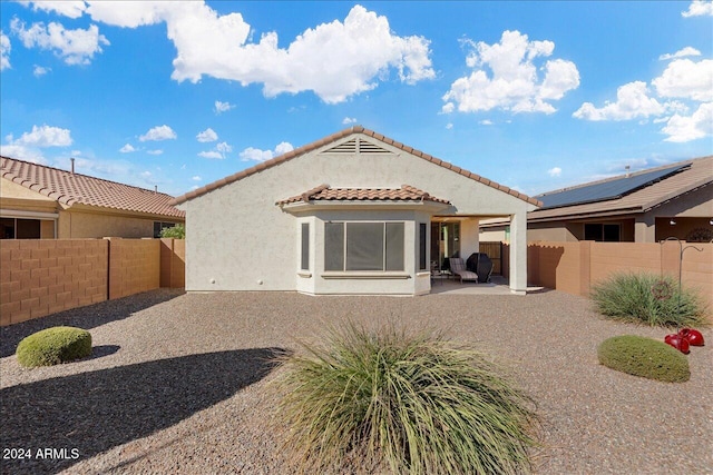 rear view of house with a patio