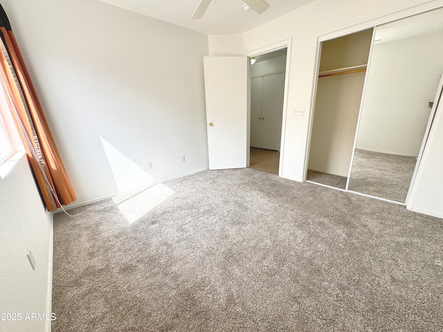 unfurnished bedroom with carpet floors, a ceiling fan, and a closet