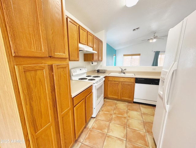 kitchen featuring visible vents, a sink, white appliances, under cabinet range hood, and lofted ceiling