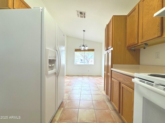 kitchen with white appliances, brown cabinetry, visible vents, under cabinet range hood, and lofted ceiling