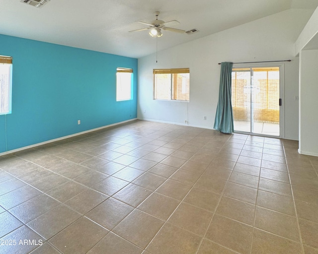 unfurnished room featuring visible vents, ceiling fan, tile patterned flooring, and vaulted ceiling