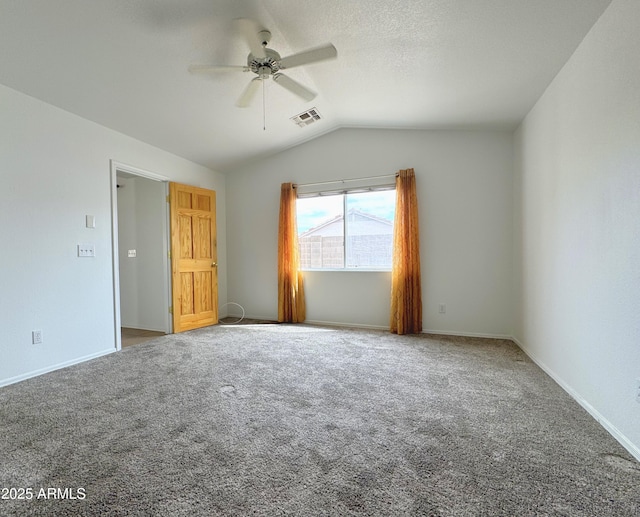 carpeted empty room featuring visible vents, baseboards, a ceiling fan, and lofted ceiling