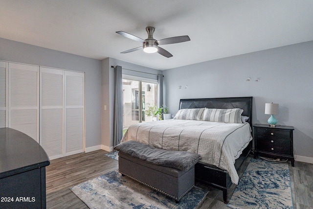 bedroom with ceiling fan, baseboards, and wood finished floors